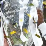 A player lifting the Champions League Trophy