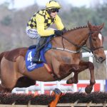 State Man jumping an obstacle in the Irish Champion Hurdle