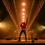 Kendrick Lamar performing on stage